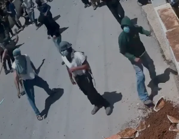 Masked settlers in Turmus Ayya